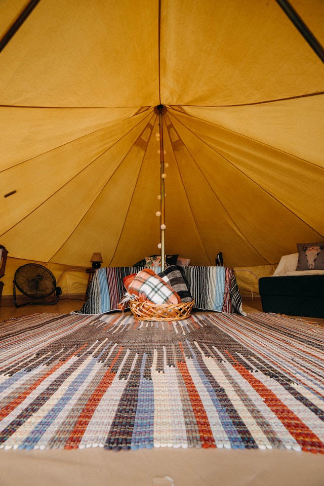 Benefits of incorporating Aztec rugs into home decor, such as adding warmth, texture, and a touch of cultural heritage